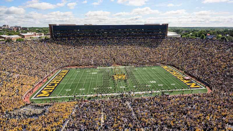 <strong>ULTIMATE WOLVERINES 2024 FAN PACKAGE FOR 2</strong><br>
<span style='text-align:left !important;'><ul><li>Former Michigan Great Derrick Walker will host a tour of the Big House, on mutually agreed upon date and time, typically a Friday</li>
<li>Game VIP: stand on the sidelines pre-game, then stay for the game (vs either TX or AR, date pending ’24 schedule)</li>
<li>Includes autographed football by Coach Harbaugh</li>
<li>Bidding starts at $1,000</li></ul></span>